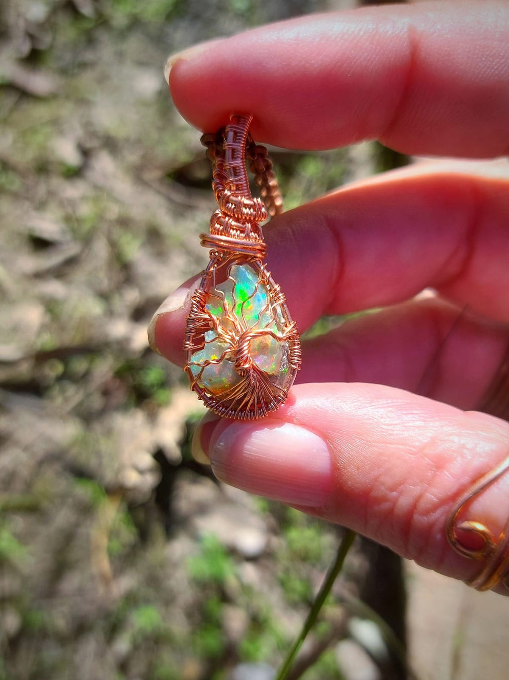 Front view of Ethiopian opal copper wrapped pendant