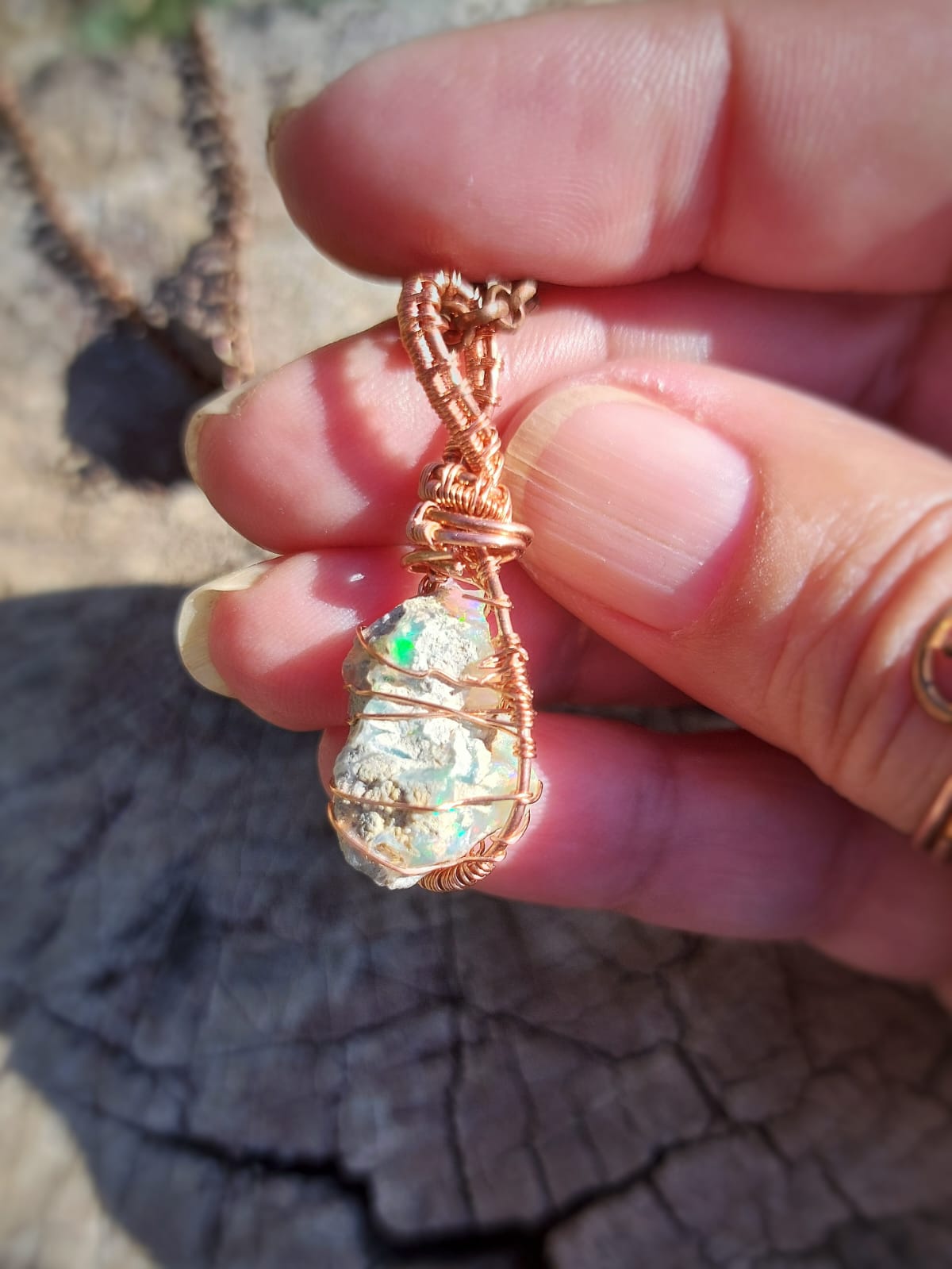 Close-up of Tree of Life wirework on Ethiopian opal stone