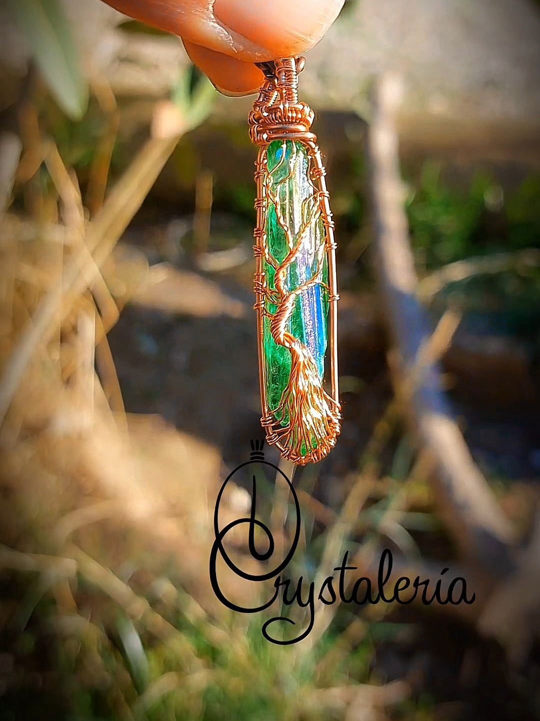 Titanium Aura Quartz Tree of Life pendant wrapped in copper wire close-up