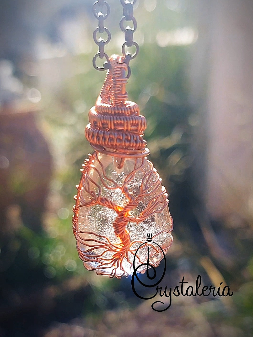 Clear quartz Tree of Life pendant wrapped in copper wire