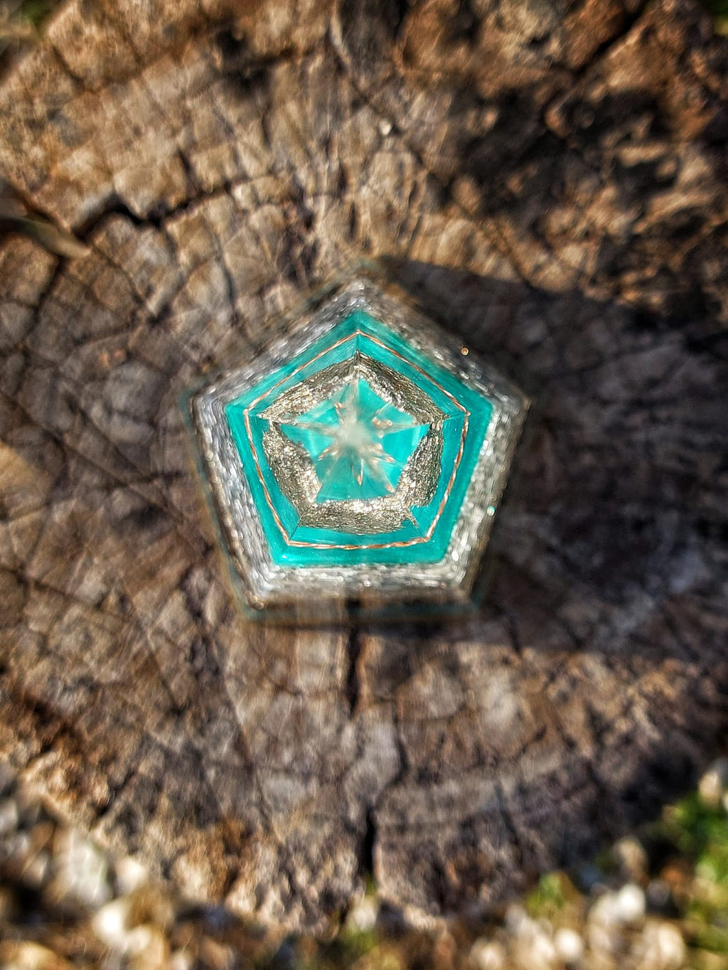 Top view of Azure Pyrite Pentagon Orgonite Pyramid showing pentagon geometry, internal tensor ring structure and turquoise resin layers for EMF and radiation neutralization