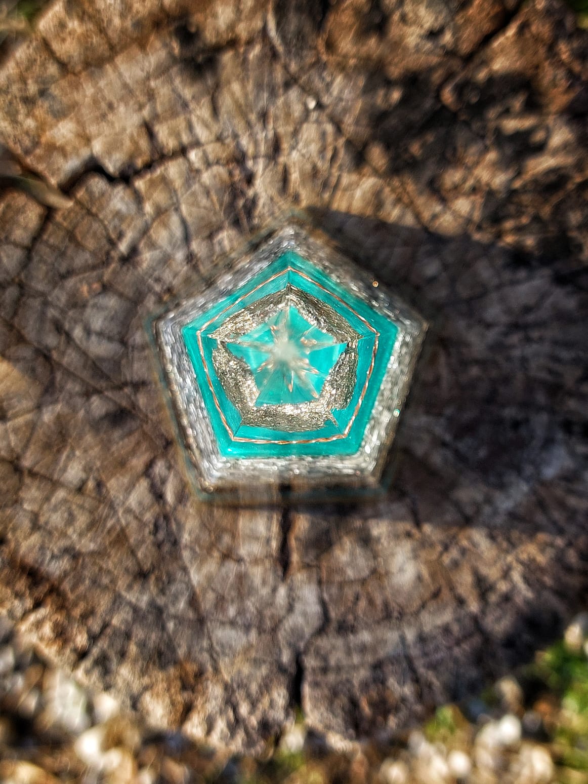 Top view of Azure Pyrite Pentagon Orgonite Pyramid showing pentagon geometry, internal tensor ring structure and turquoise resin layers for EMF and radiation neutralization