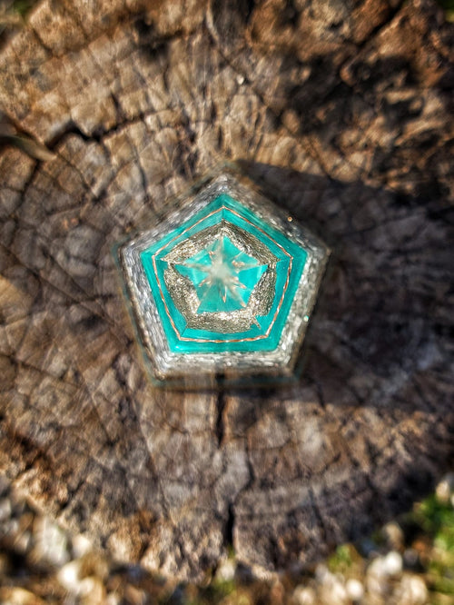 Top view of Azure Pyrite Pentagon Orgonite Pyramid showing pentagon geometry, internal tensor ring structure and turquoise resin layers for EMF and radiation neutralization