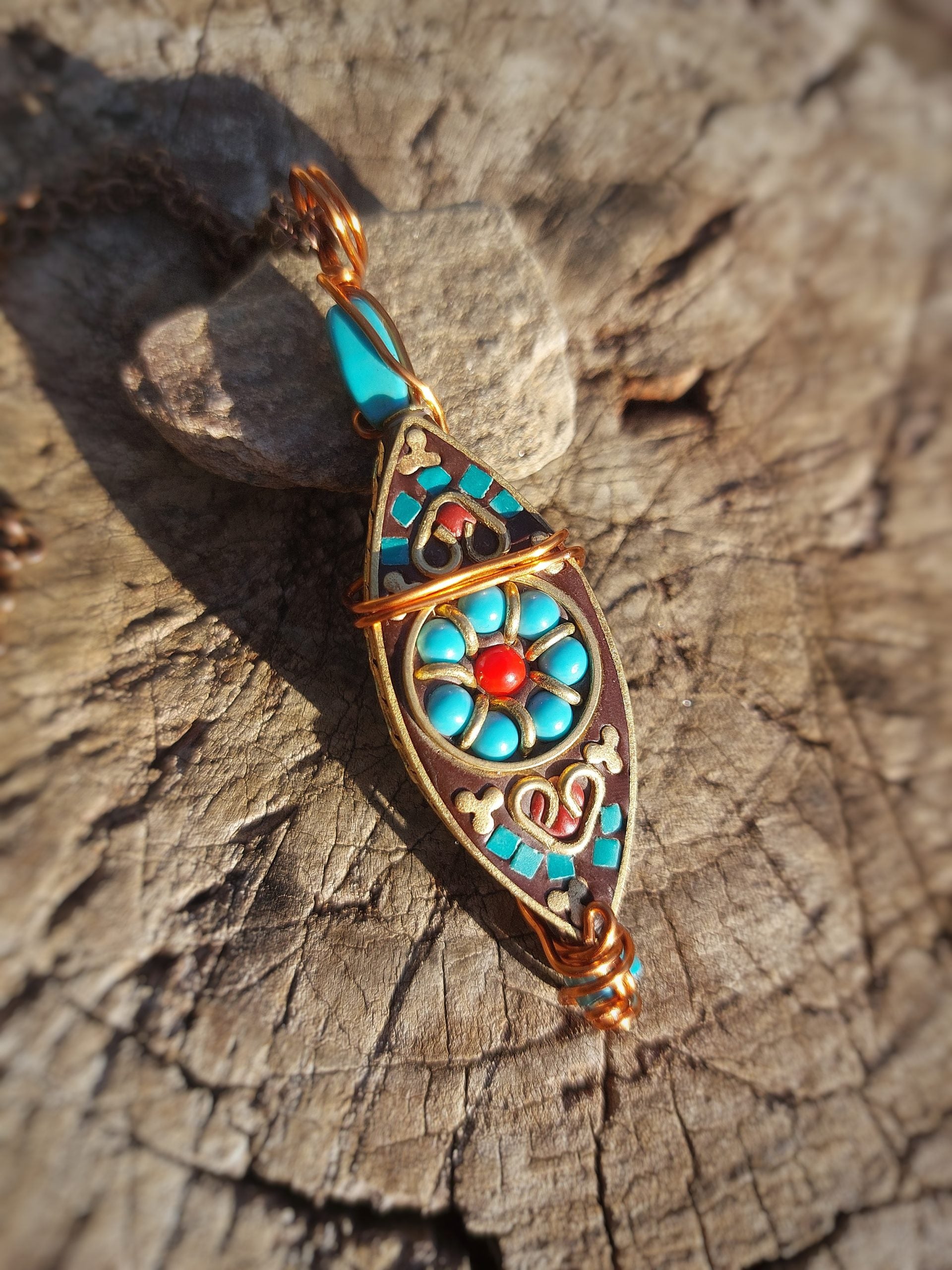 Front view of Tibetan turquoise copper wrapped pendant
