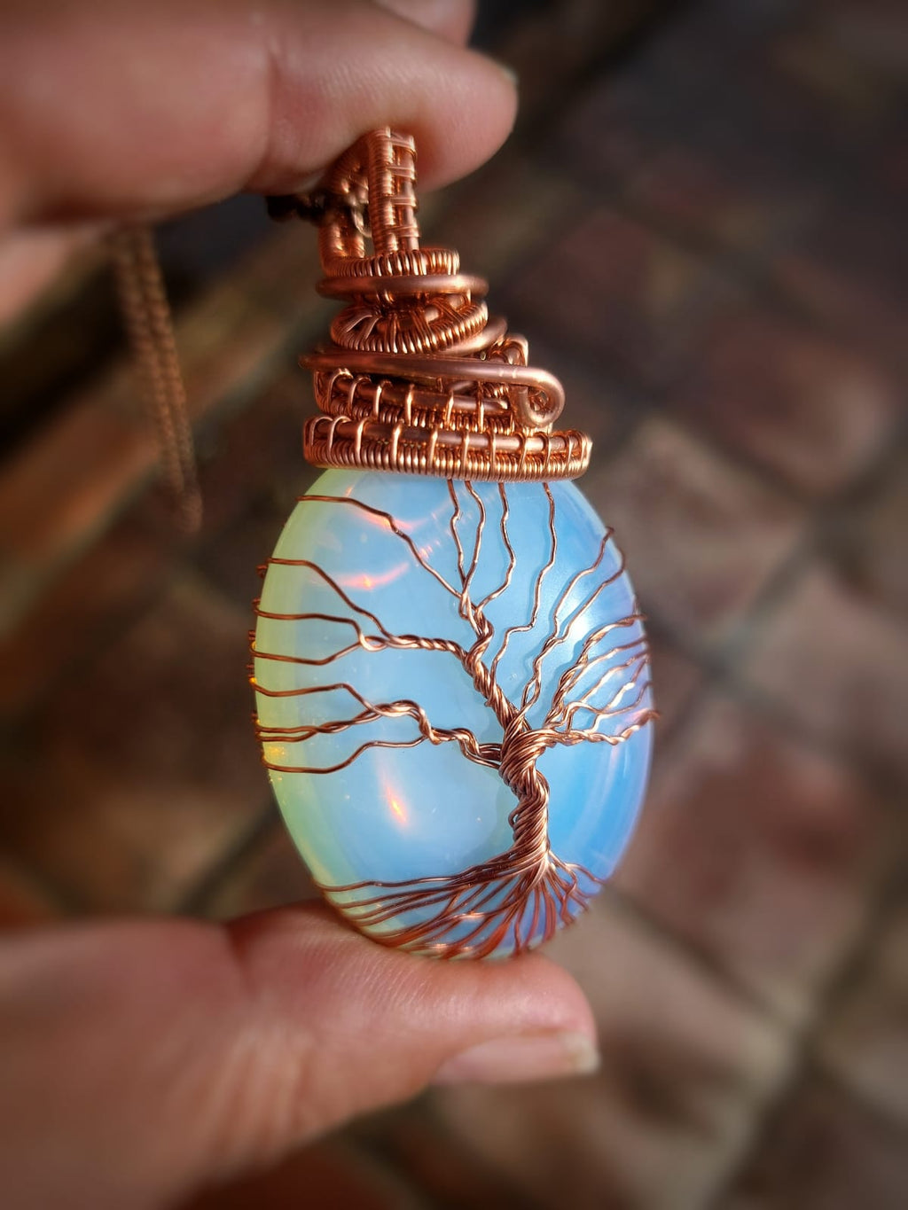 Opalite Tree of Life copper wire wrapped pendant with glowing blue opalite crystal